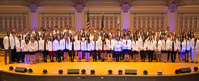 class picture of students in white coats